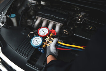 Car care maintenance and service, Hand technician auto mechanic using measuring manifold gauge...