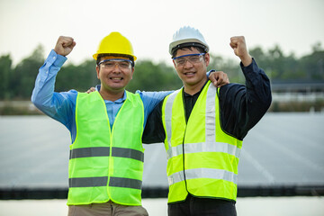 Two Engineer worker working together at Solar panel.