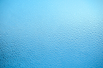 Fototapeta na wymiar Blue glass texture. Abstract background, decorative glass surface.