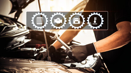 Close-up hand auto mechanic using the wrench to repairing car engine problem. Concepts of check and...
