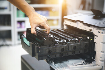 Technician hand open cover printer photocopier or photocopy to replace ink cartridges or fix paper...