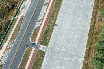 empty parking lot in suburb area. aerial view in sunny summer day.