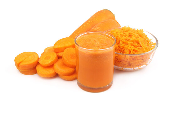 Sliced and grated carrot with carrot juice isolated on white background.