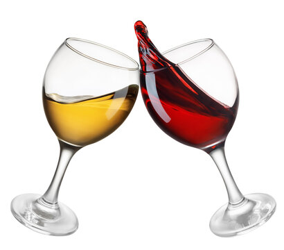 glasses of red and white wine in toasting gesture with splash