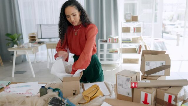 Black woman, box and logistics for delivery, ecommerce or packing cargo for shipping on office desk. African American female in small business packaging fashion product, shipment or courier service