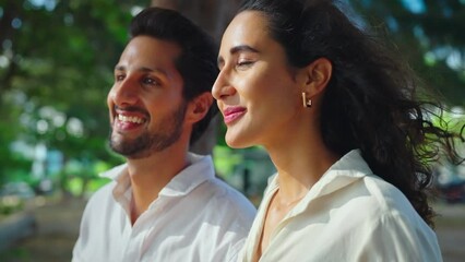 A young couple enjoys nature together, reveling in the fresh air and experiencing happiness. This embodies the concept of emotional wellbeing and a healthy lifestyle.