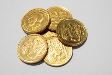 A pile of gold coins isolated on white