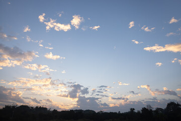 Beautiful sky and cloud at high. Landscape include space, light of nature, sunset, sunrise, horizon or skyline. Colorful with yellow, orange and blue at evening in autumn for background and wallpaper.
