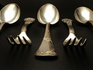 antique cutlery on a black background