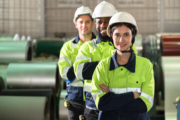Portrait Asia engineer woman with team and metal sheet background