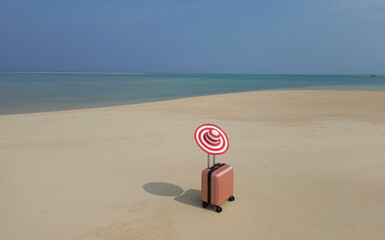 The orange luggage on the beach- summer travel concept
