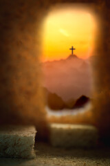 Cross crucified with cave or tunnel It is the tomb where his lifeless body is placed. The concept of the resurrection of Jesus in Christianity. Crucifixion on Calvary or Golgotha hills in holy bible. - obrazy, fototapety, plakaty