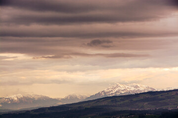 Naklejka na ściany i meble Panoramic view of dramatic, cloudy skies over the swiss central Alps - with mountains, Pilatus, Switzerland