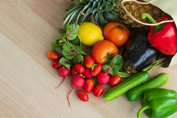 Food backgrounds. Fruits and vegetables in paper bag on wooden background.