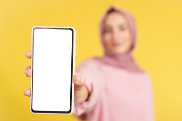 Blank screen of the mobile held by a muslim woman