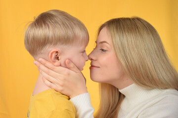 mother hugs her baby boy