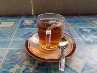 teabag in a glass cup ready to be sipped