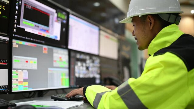 Engineer working at control room,Manager control system,Technician man monitoring program from a lot of monitor