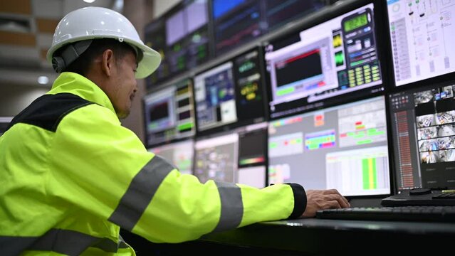 Engineer working at control room,Manager control system,Technician man monitoring program from a lot of monitor