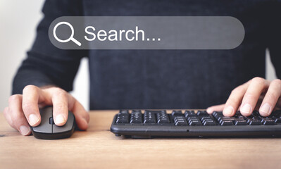 Internet search concept. User uses a computer with the Internet.