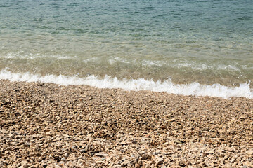 waves on the pebble beach of Orebic, peninsula Peljesac, Croatia
