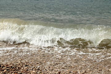 waves on the pebble beach of Orebic, peninsula Peljesac, Croatia