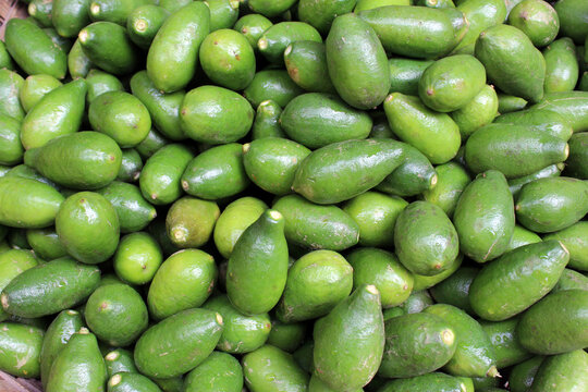 Green Color Lemon fruit background. Green Lemon fruits for sale. Green lemon background.