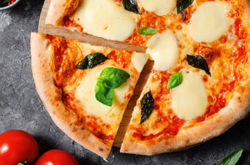 Italian Pizza Margherita with Mozzarella Cheese and Basil Leaves on Dark Background, Freshly Baked Pizza