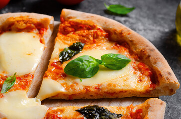 Italian Pizza Margherita with Mozzarella Cheese and Basil Leaves on Dark Background, Freshly Baked Pizza