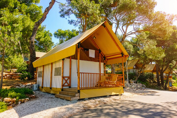 Luxurious glamping with teepee camping tents in a wooded area. Croatia, Europe.