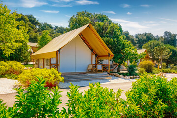 Glamorous modern glamping with canvas tents in a picturesque protected area. Croatia, Europe.
