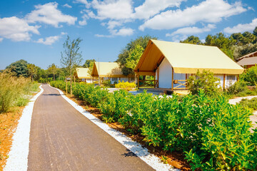 Glamorous modern glamping with canvas tents in a picturesque protected area. Croatia, Europe.