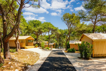 Luxurious glamping with teepee camping tents in a wooded area. Croatia, Europe.