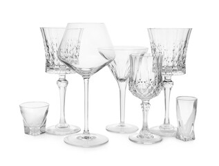Different elegant empty glasses isolated on white