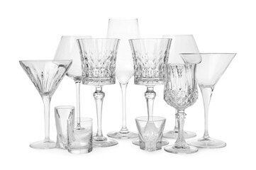 Different elegant empty glasses isolated on white