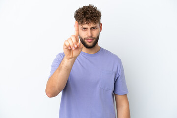 Fototapeta premium Young handsome caucasian man isolated on white background counting one with serious expression