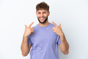 Fototapeta premium Young handsome caucasian man isolated on white background giving a thumbs up gesture