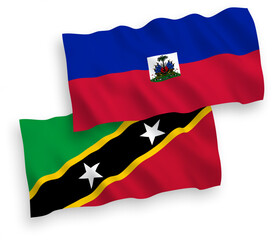 Flags of Federation of Saint Christopher and Nevis and Republic of Haiti on a white background