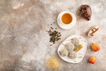 Japanese rice sweet buns mochi filled with pandan jam on brown concrete, top view, copy space.