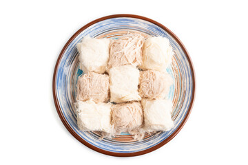 Fototapeta na wymiar traditional arabic sweets pishmanie isolated on white, top view.