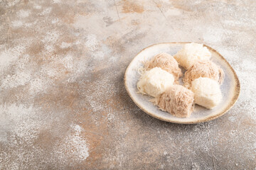 traditional arabic sweets pishmanie on brown concrete, side view, copy space.