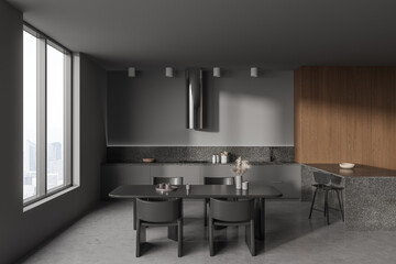 Grey home kitchen interior with cooking and dining area, panoramic window