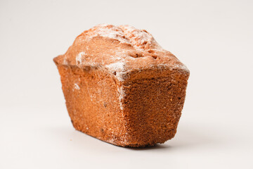 A cupcake with raisins isoalted on a white background.