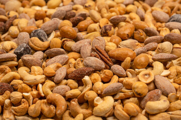 A group of almonds, pistachios, walnuts, macadamia, cashews.