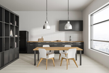White kitchen with cabinets and table