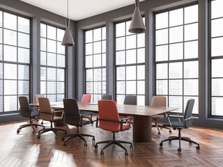 Stylish meeting room interior with table, armchairs and panoramic window