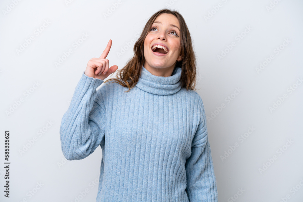 Poster Young caucasian woman isolated on white background pointing up and surprised