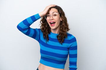 Young caucasian woman isolated on white background doing surprise gesture while looking to the side