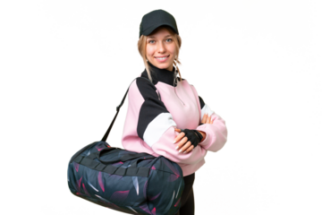 Pretty sport woman with sport bag over isolated chroma key background with arms crossed and looking forward