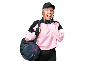 Pretty sport woman with sport bag over isolated chroma key background with surprise and shocked facial expression
